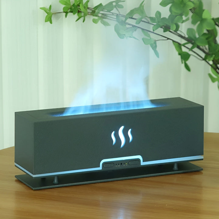 GlowFlame aroma humidifier in Dark Grey with blue flame effect and green foliage