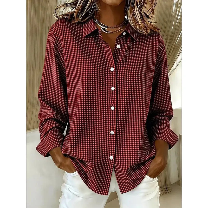 Folded stack of women's checked button-up shirts in assorted colors