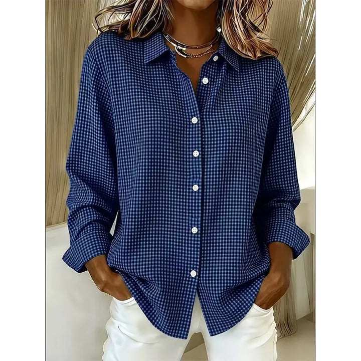 Flat lay styling of women's gingham button-up shirt with accessories