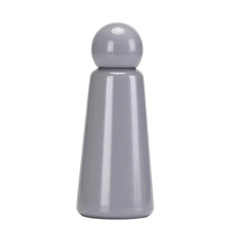 Matte finish travel mug and thermos resting on a flat surface