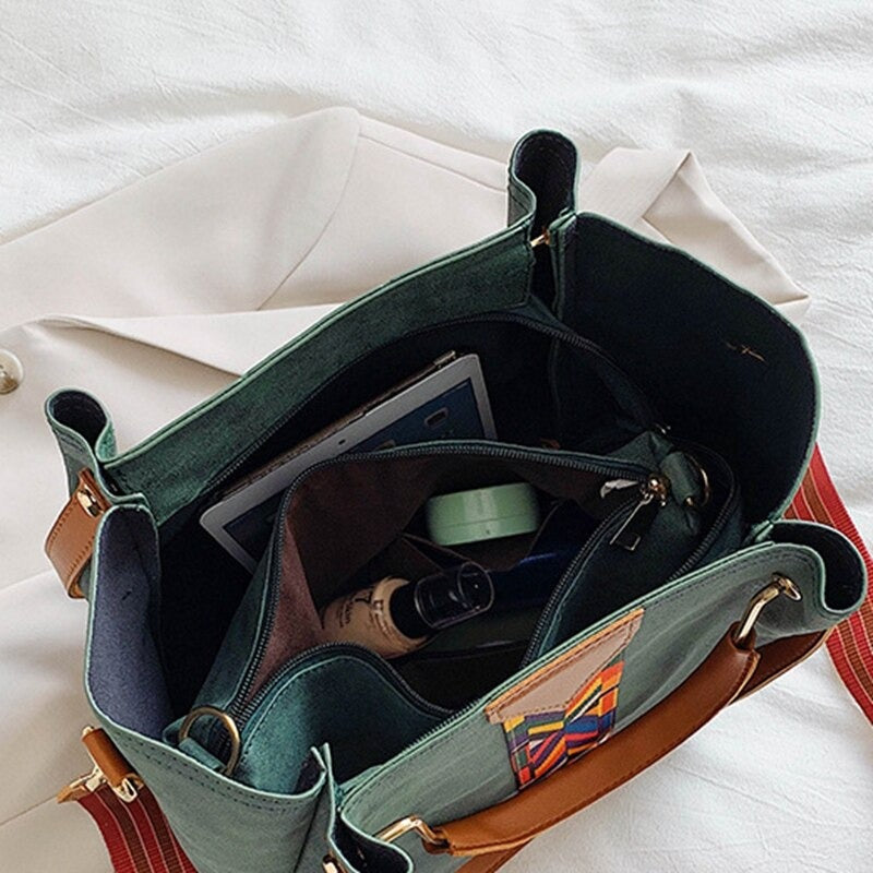 Detailed shot of reinforced strap attachment on everyday carry bag