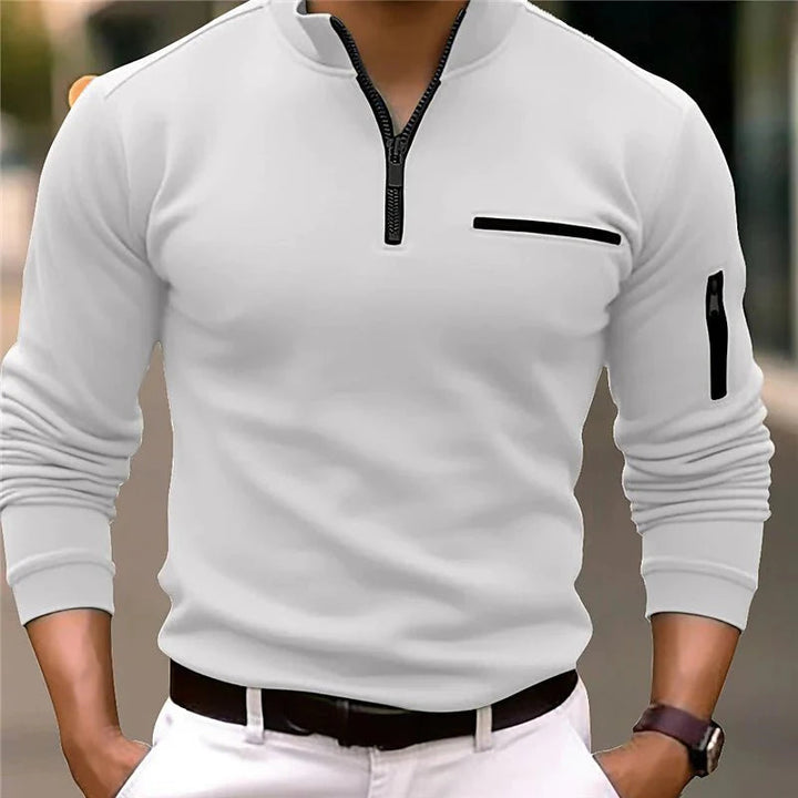 Man wearing white quarter-zip sweater with detailed chest pocket