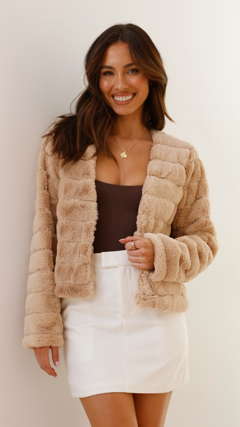 Pink cropped texture jacket worn over trendy seasonal street fashion