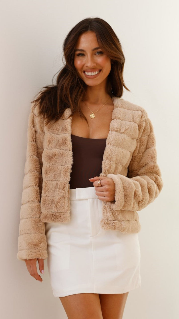 Pink cropped texture jacket worn over trendy seasonal street fashion