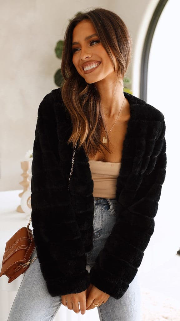 Front view of grey textured cropped jacket displaying modern collar design