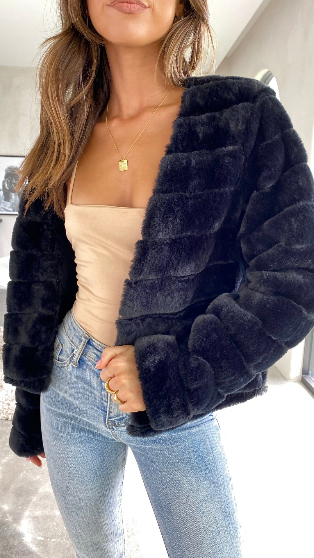White cropped texture jacket paired with casual denim for chic style
