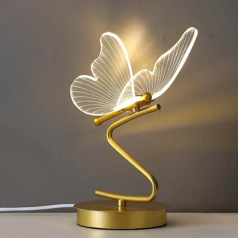 Modern butterfly LED table lamp emitting warm bedroom lighting for home decor
