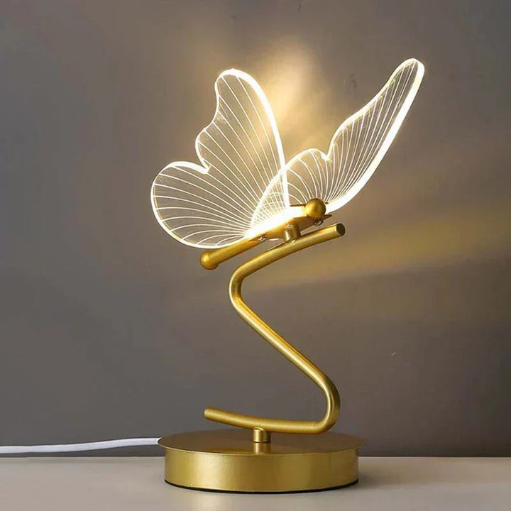 Modern butterfly LED table lamp emitting warm bedroom lighting for home decor