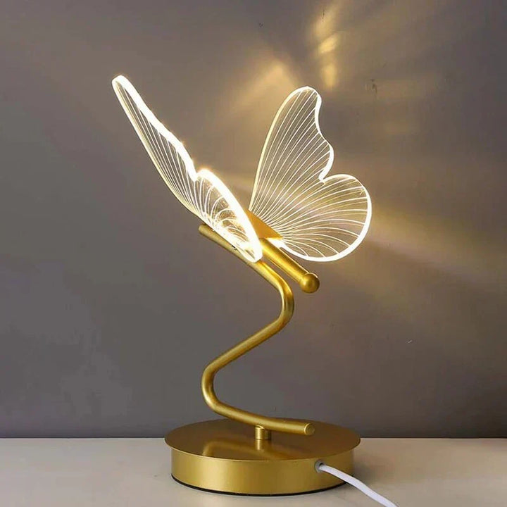 Close-up of the elegant butterfly LED lamp showing modern desk lighting design