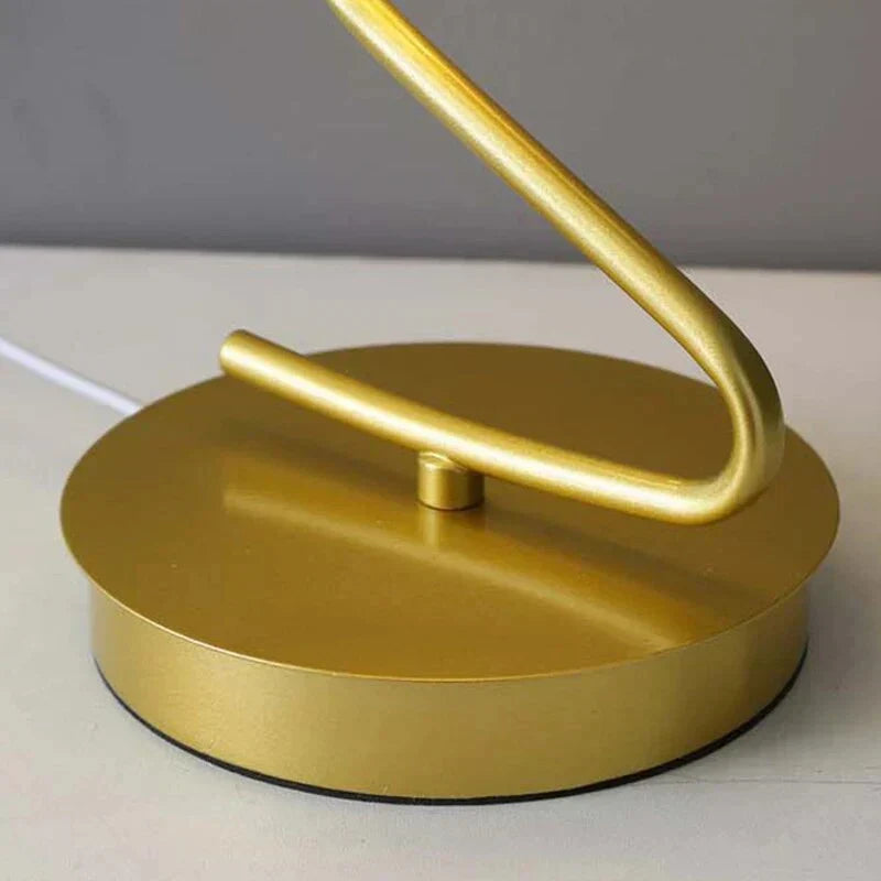 Stylish butterfly shaped LED nightstand light glowing in a cozy bedroom setting