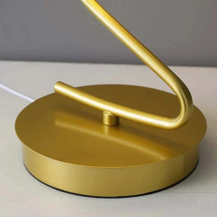 Stylish butterfly shaped LED nightstand light glowing in a cozy bedroom setting