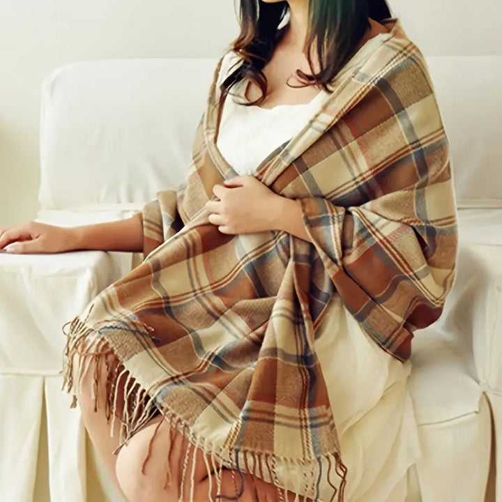Woman wearing brown check winter scarf draped over shoulders