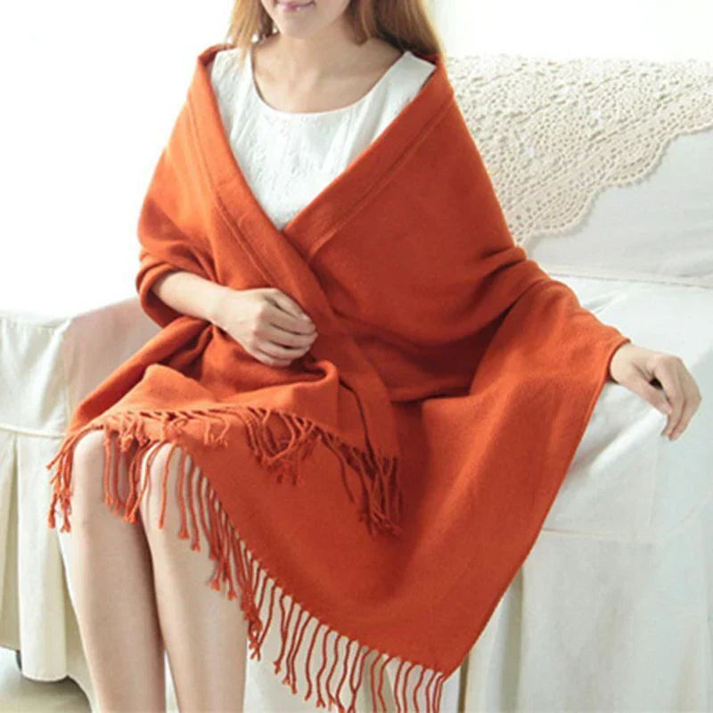 Stylish women's scarf styled for cold weather with a cozy winter outfit