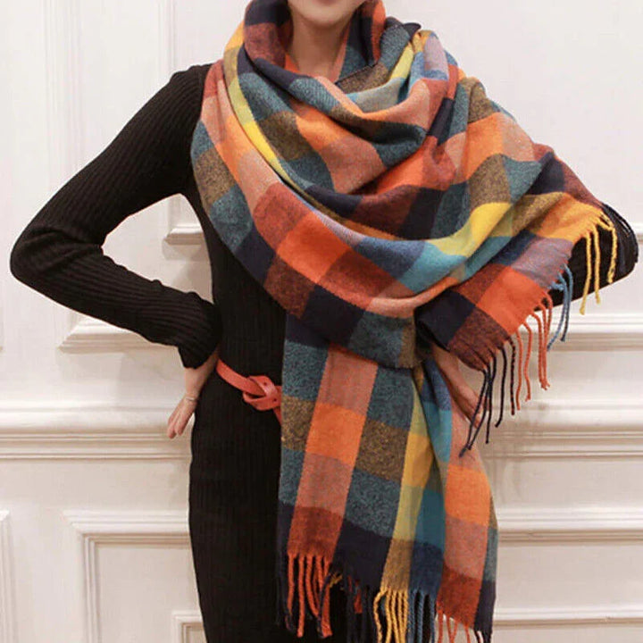 Side profile of a woman wrapped in a warm luxury check winter scarf