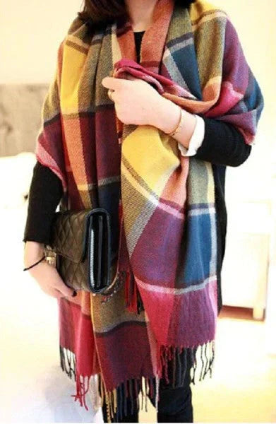 Woman wearing multicolored rainbow check winter scarf
