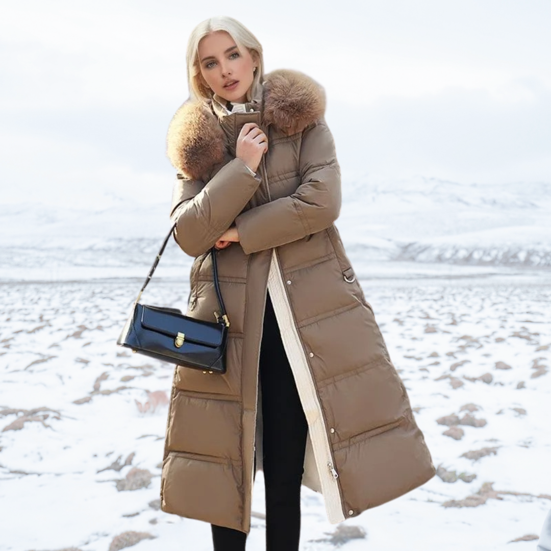 Model posing with black handbag and brown long winter coat outdoors