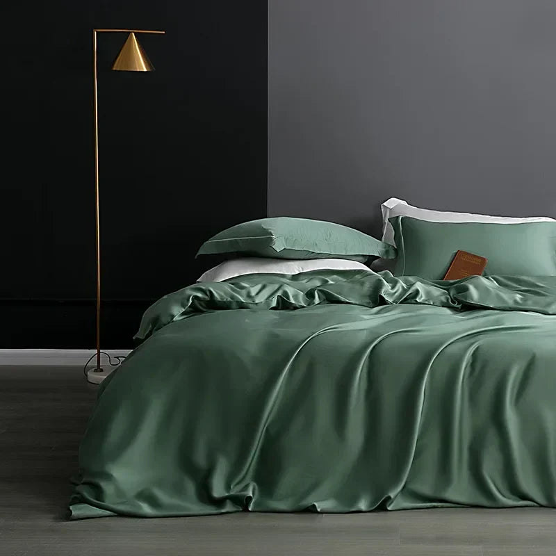 Luxury green silk duvet cover set on a modern bed