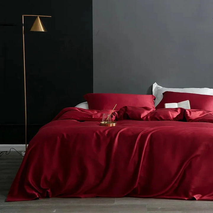 Rich red silk duvet cover adding elegance to a bedroom