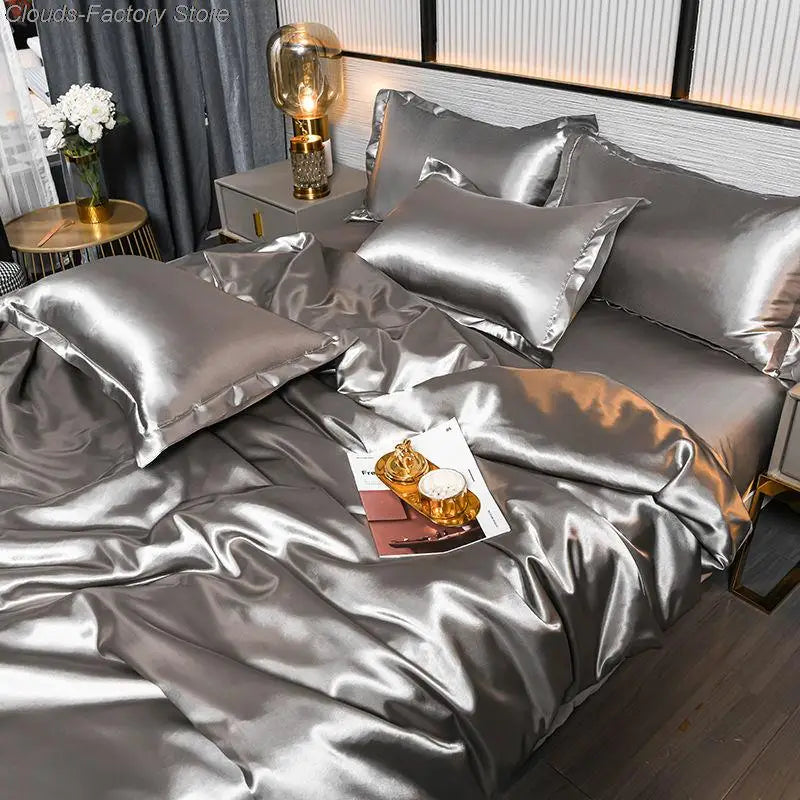 Silver luxury satin duvet cover set on a modern bed with matching pillows