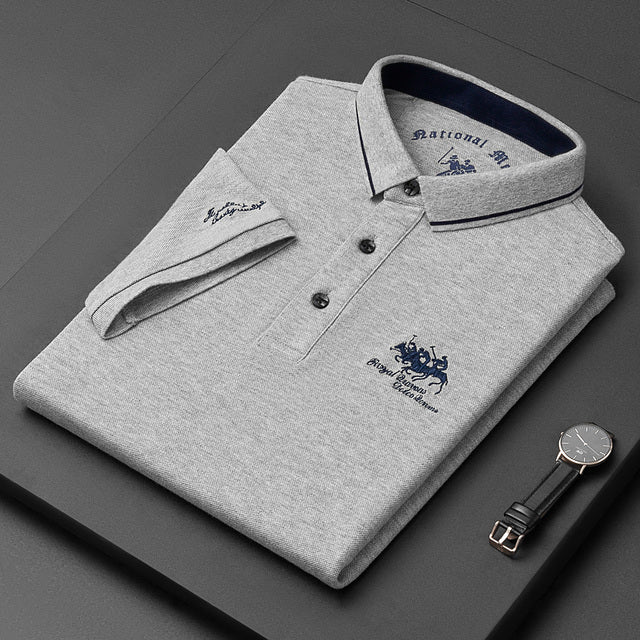 Folded gray men's luxury polo shirt with contrast collar trim and classic button placket