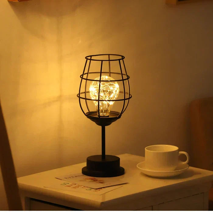 Modern decorative LED table lamp showing the sleek black metal stem and minimalist aesthetic