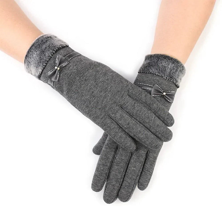 Close-up of warm winter gloves for women featuring smartphone compatible fingertips