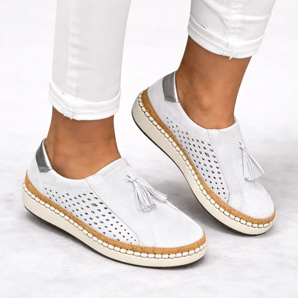 Pair of casual slip-on sneakers for women with orthotic support and textured outsole