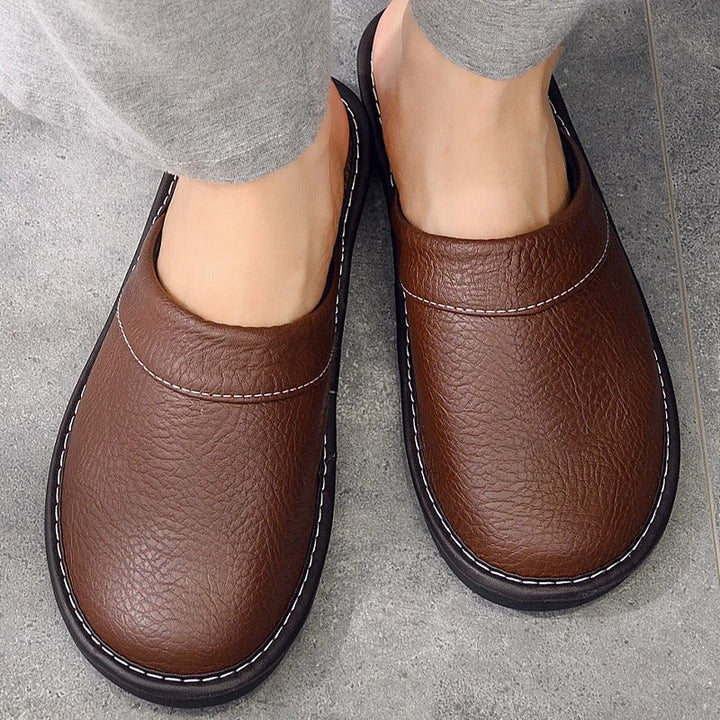Mens ergonomic comfort slippers in classic neutral colorway, front angle view