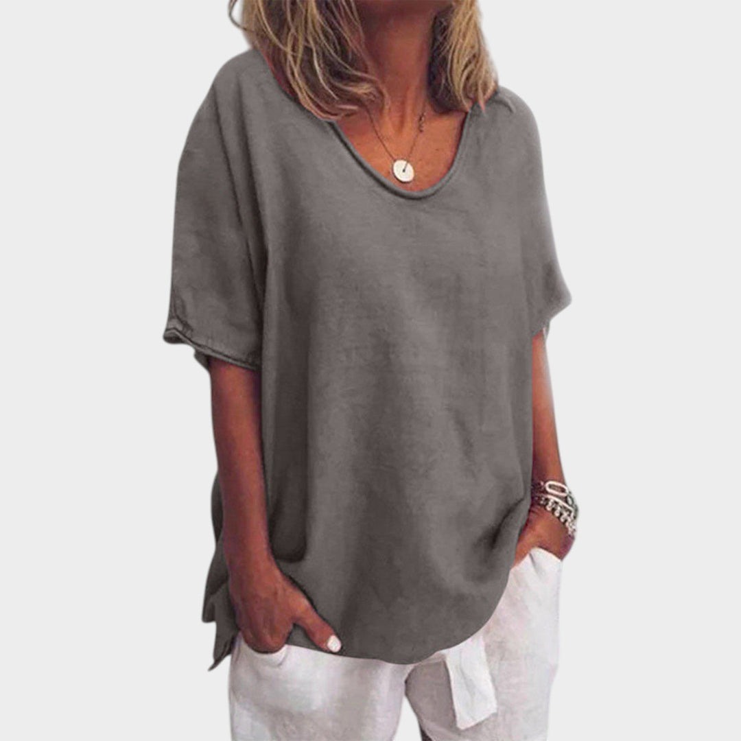 Woman wearing dark gray relaxed fit round neck t-shirt with short sleeves