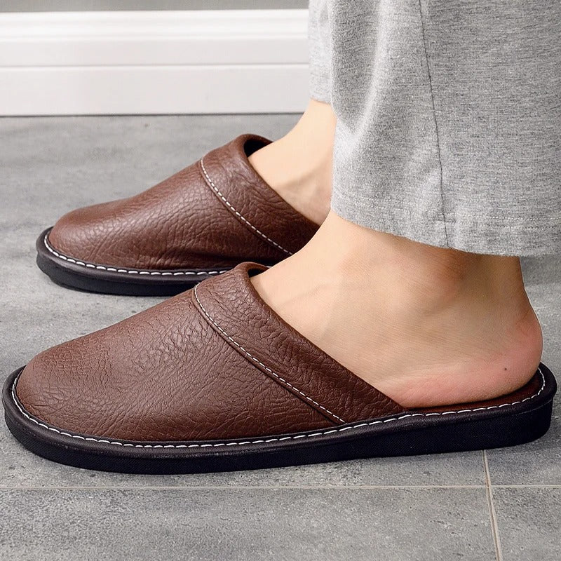 Comfortable slip on clog slippers for men showing textured sole and side profile