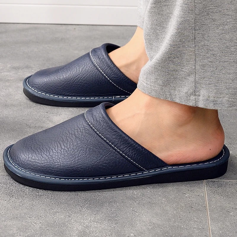 Mens footwear for indoor relaxation displayed at a three quarter angle