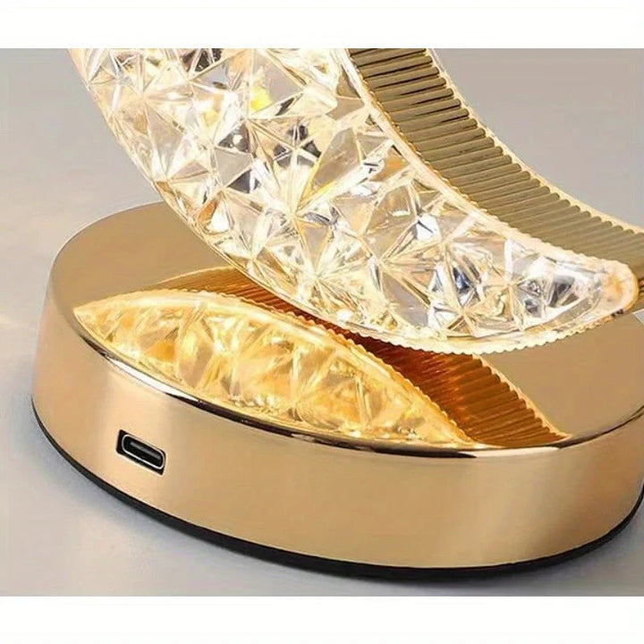 Close up view of the charging port and golden base of the crystal lamp