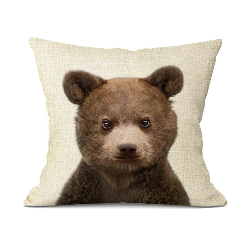 Playful pillow case paired with neutral cushions on a couch