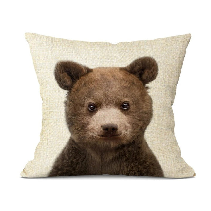 Playful pillow case paired with neutral cushions on a couch