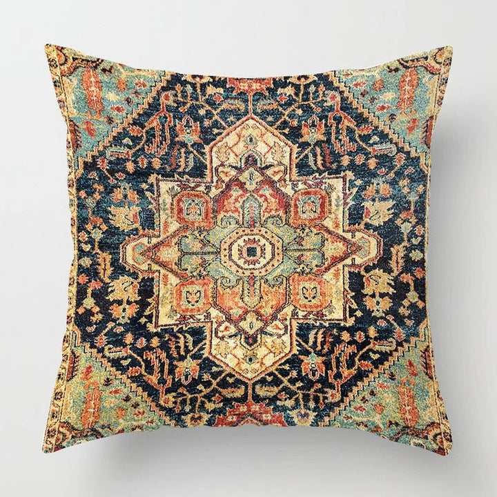 Close-up view of the intricate geometric embroidery on a bohemian throw pillow cover.