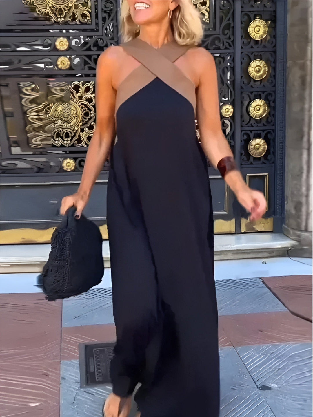 Woman wearing black breathable crossed maxi dress outdoors