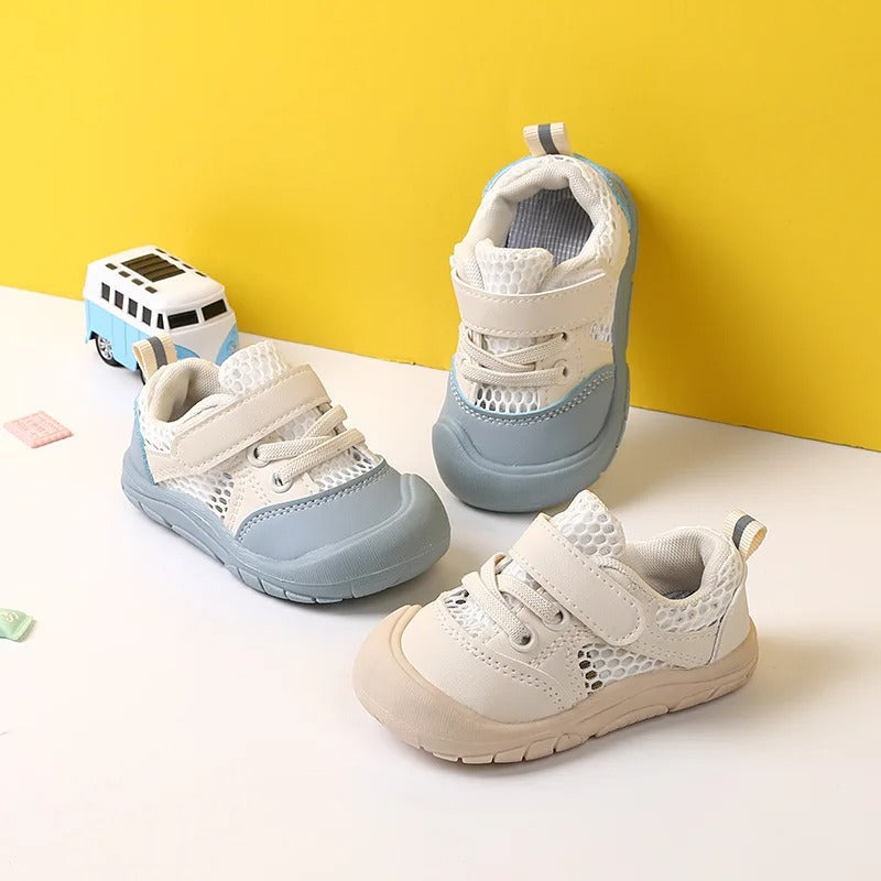 Three children's barefoot shoes in blue and beige displayed on a white surface with a yellow background.