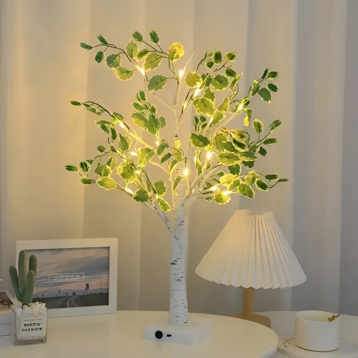Glowing fairy light tree lamp operating on batteries for easy placement