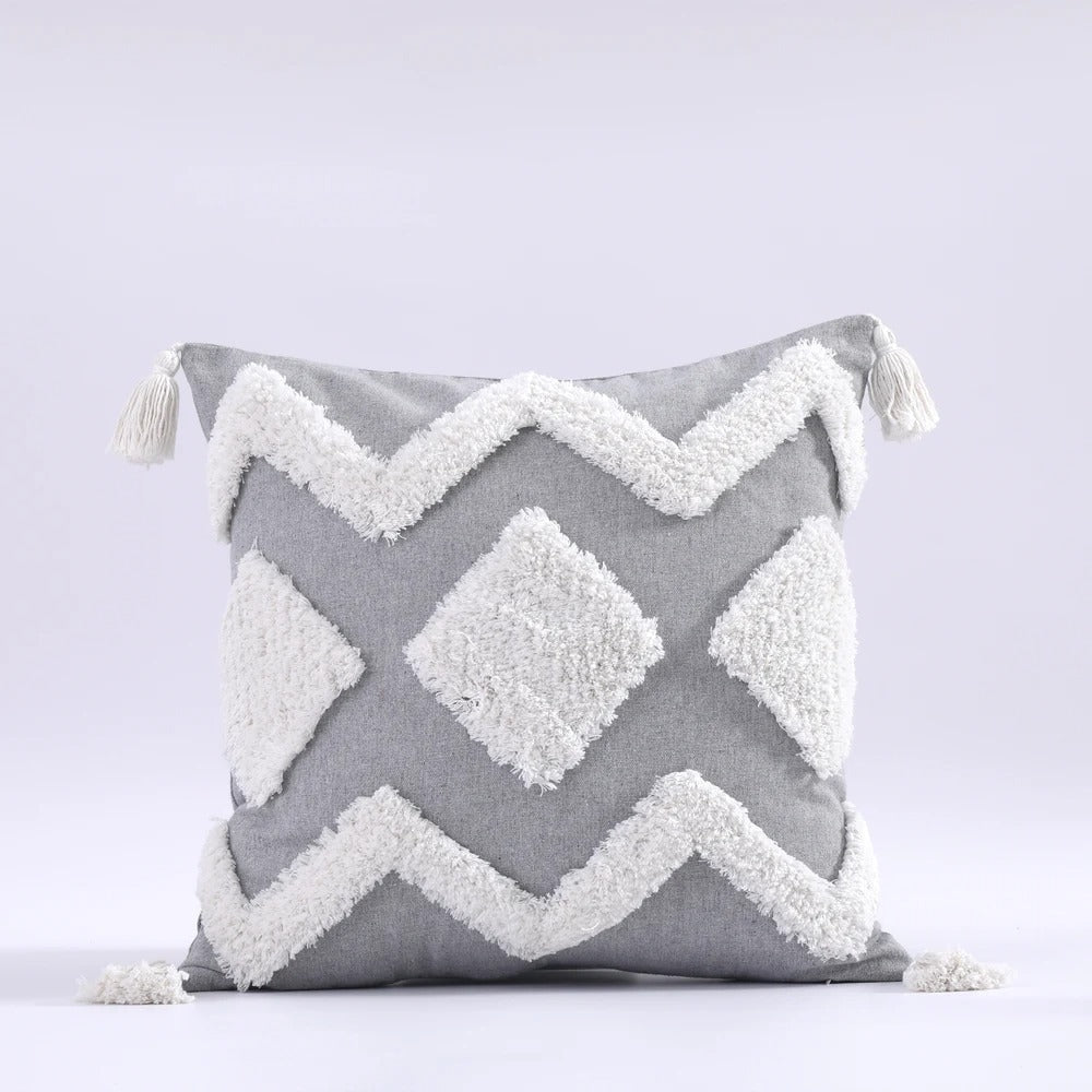 Detailed view of bohemian style tufted throw pillow