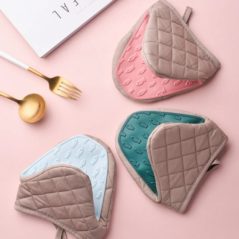 Silicone fish shaped oven glove demonstrating heat resistance in kitchen