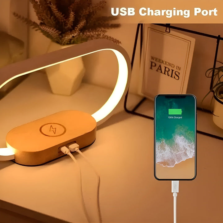 Multifunctional bedside lamp showing adjustable brightness settings