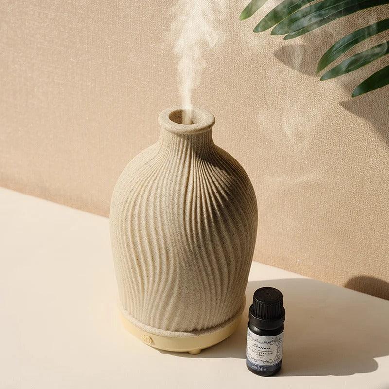 Top-down view of the ultrasonic aroma diffuser emitting a fine vapor stream.