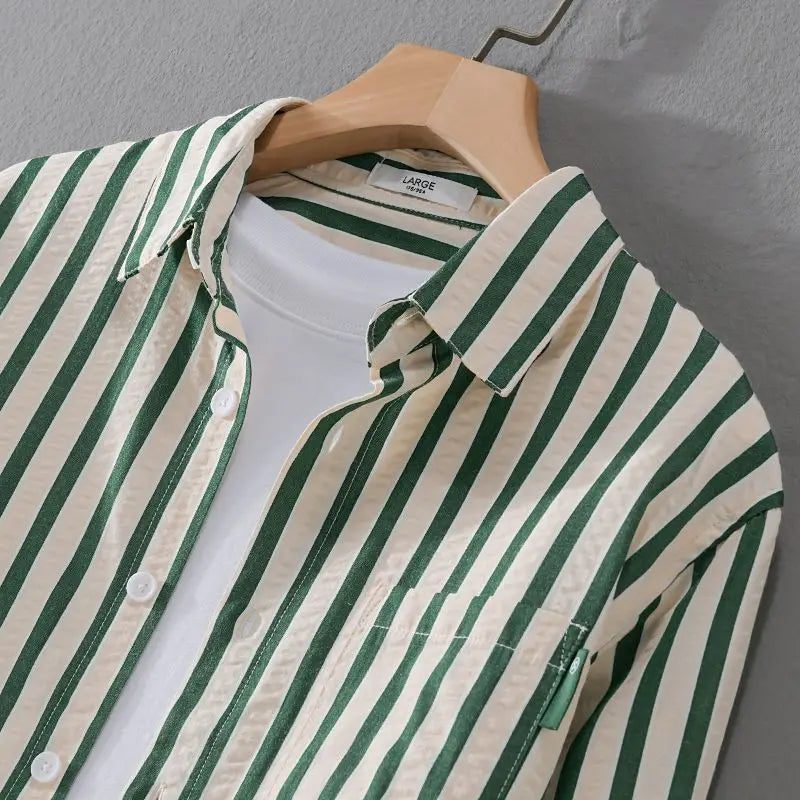 Close-up of the collar and button placket on the striped men's shirt