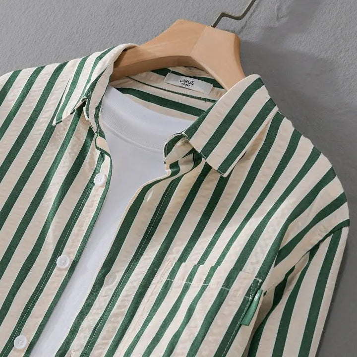 Close-up of the collar and button placket on the striped men's shirt