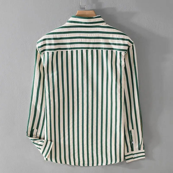 Back view of the green and cream striped long sleeve shirt on a hanger