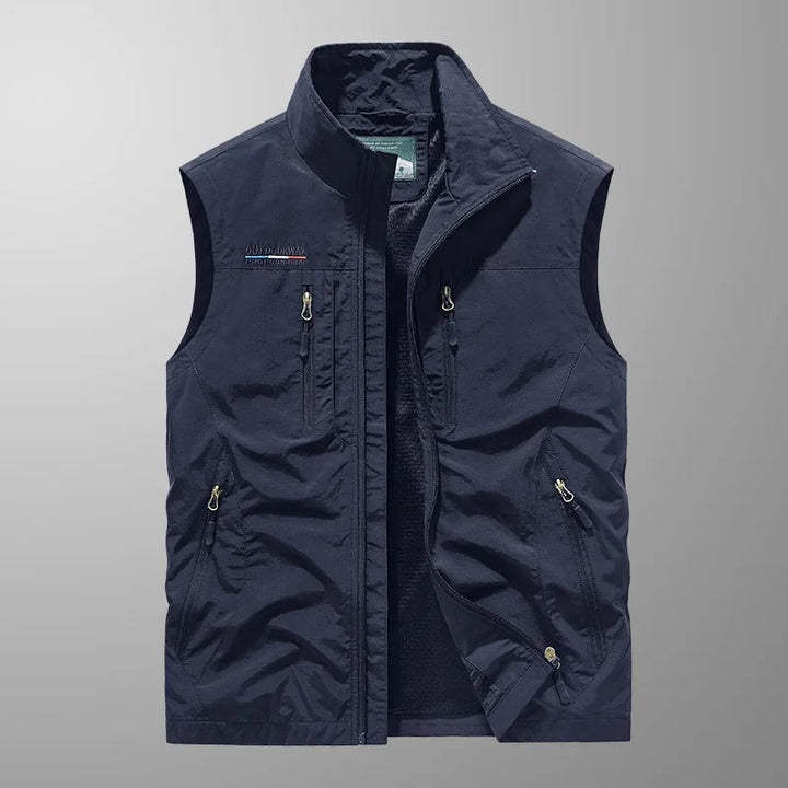 Detailed shot of fabric texture and utility features on a lightweight sleeveless jacket.