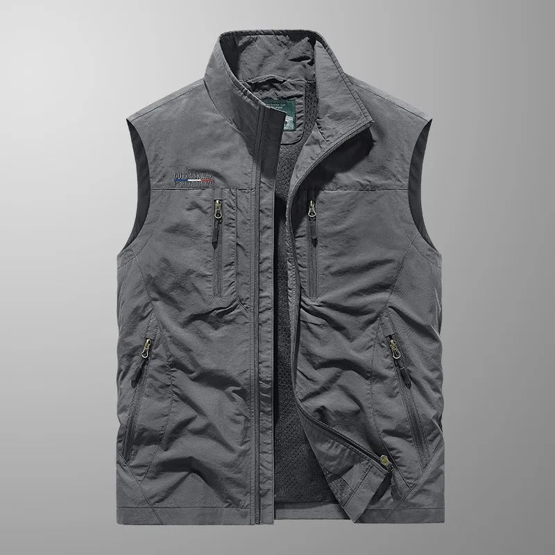Men's full zip utility vest in gray featuring zippered compartments