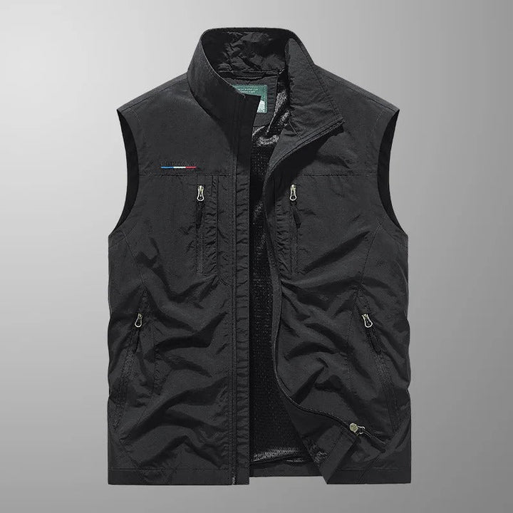Men's full zip utility vest in black shown from the front