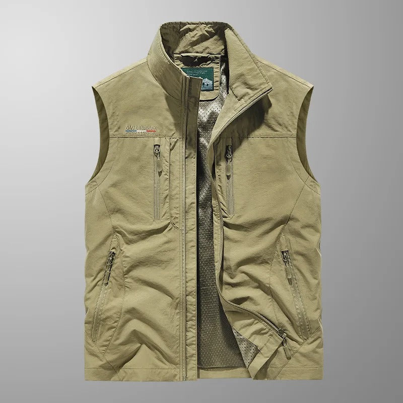 Back view of a mens full zip utility vest in durable outdoor fabric with multiple pockets.