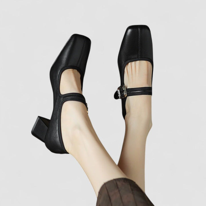Stylish black women's footwear featuring orthopedic arch support